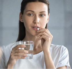 woman taking magnesium which helps pre and post exercise